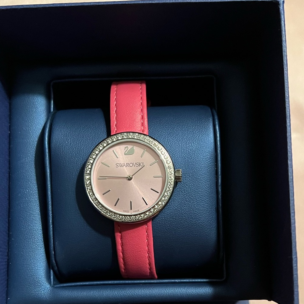 Swarovski mini pink leather band watch.